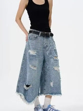 Men’s light-wash denim wide leg jeans with distressed raw hem and frayed holes plus size culottes design