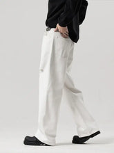 Men’s full size distressed ripped wide white denim jeans with relaxed fit and subtle distressing on the thigh