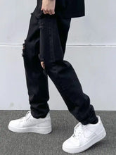 Men’s full size black distressed slim fit denim jeans with ripped knees and tapered fit for a modern look
