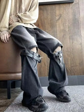 Men’s full size black distressed wide leg jeans with reinforced leather straps and buckled thigh detailing