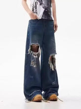 Men’s dark blue wide leg jeans with frayed ripped holes at the knees full size distressed denim leg jeans