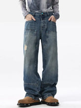 Men’s full size distressed wide leg jeans in blue denim with visible wear patterns and slightly stretchy fabric care instructions