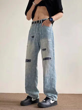 Men’s full size distressed wide leg light-wash denim jeans with distressed patches and subtle paisley pattern