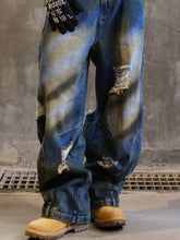 Men’s full size distressed wide leg jeans in blue denim with intentional rips and faded patches for lasting comfort crafted