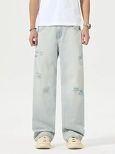 Men’s full size light-wash denim wide leg jeans with distressed ripped patches for a size distressed look