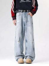 Men’s plus size light-wash denim wide-leg jeans with distressed wash paint splatter and subtle fading details