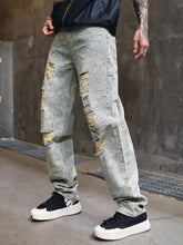 Men’s light-wash denim distressed wide leg jeans with faded paisley pattern ripped knees for perfect fit plus size