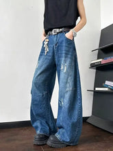 Men’s blue denim full size distressed wide-leg jeans with distressed patches and keychain on front pocket