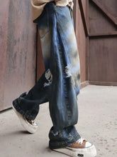 Men’s full size distressed wide-leg jeans plus size in blue denim with faded wash and ripped details