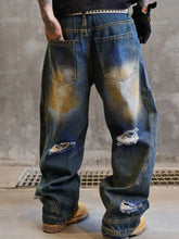 Men’s full size distressed wide-leg jeans in blue denim with faded wash ripped knees and frayed edges for lasting comfort crafted