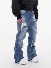 Men’s full size distressed wide leg jeans in blue denim with intentional rips and frayed edges