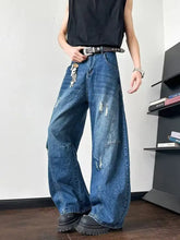 Men’s full size blue denim distressed wide leg jeans featuring distressed wide patches and a wide-leg cut