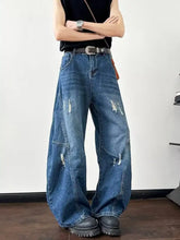 Men’s full size distressed wide leg jeans in blue denim with distressed wide patches and wide-leg jeans style