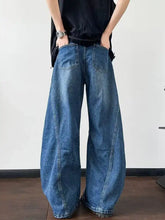 Men’s blue denim distressed wide leg jeans with relaxed tapered fit and visible stitching details plus size full size