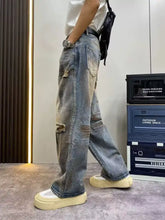 Men’s full size distressed wide leg blue denim jeans with ripped knees and faded wash in plus size fit