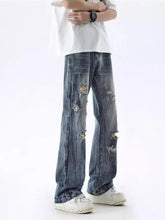 Men’s full size distressed wide leg jeans in blue distressed denim with ripped and frayed details
