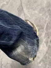 Men’s full size distressed wide leg jeans offer dark blue denim with frayed hem and visible stitching details