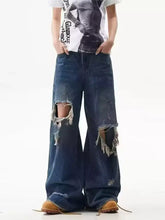 Men’s full size dark blue distressed wide leg jeans with ripped knees and frayed edges in denim material
