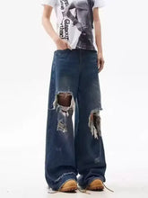Men’s full size distressed wide leg jeans in dark blue denim with ripped knees and frayed edges