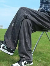 Men’s dark gray distressed wide leg jeans with faded look and white star embroidery on legs in full plus size