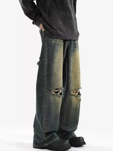 Men’s dark-wash distressed wide leg jeans with ripped knees and faded greenish-yellow patches plus size leg jeans
