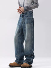 Men’s full size distressed wide leg jeans in faded blue denim with slightly stretchy fabric and reinforced stitching care instructions included