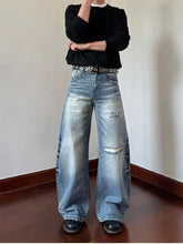 Mens full size distressed wide leg jeans in faded blue denim with ripped details and distressed wide leg design