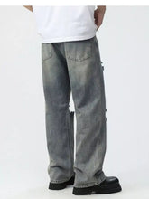 Men’s plus size grey distressed denim wide leg jeans with frayed cuffs and subtle fading