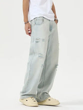 Men’s full size light-wash denim wide leg jeans with distressed ripped details on thighs and knees