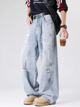 Men’s plus size wide-leg jeans in light wash denim with distressed wash and ripped faded speckled details