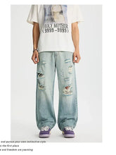 Men’s light-wash denim full size distressed wide leg jeans with ripped details in plus size for casual wear
