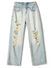 Men’s full size distressed wide leg jeans in light-wash denim with frayed ripped patches on the thighs