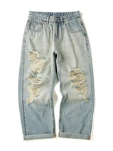 Men’s full size distressed wide leg jeans in light-wash denim with frayed patches and rolled cuffs