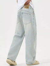 Men’s full size distressed wide leg jeans in light-wash denim with a relaxed fit and subtle distressed wide leg details