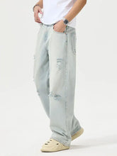 Men’s full size distressed light-wash denim wide leg jeans with ripped details and relaxed fit for casual wear