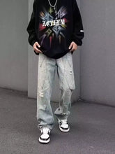 Men’s full size light-wash distressed wide-leg jeans with decorative stitching perfect for casual wide-leg jeans wear