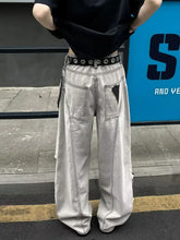 Men’s full size distressed light-wash denim wide leg jeans with black belt and silver-toned eyelets detail on right pocket