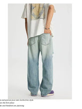 Men’s full size distressed wide leg jeans in light-wash denim with a relaxed fit and subtle fading for a modern casual look