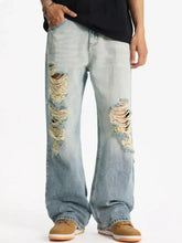 Men’s light-wash denim full size distressed wide leg jeans with frayed holes on the thighs in plus size
