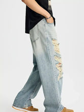 Men’s light-wash denim distressed wide leg jeans with frayed tear details along the outer leg in plus size