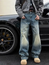 Mens full size washed blue denim wide leg jeans with distressed faded patches and a relaxed fit