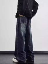 Dark-wash men’s full size distressed wide leg jeans with subtle fading and a wide leg cut for plus size fit