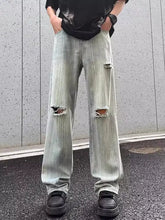 Men’s full size light-wash distressed wide leg jeans with ripped knees and a slightly stretchy relaxed fit