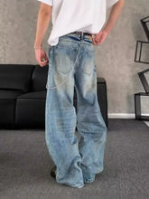 Men’s light-wash denim jeans with a distressed wide leg cut designed for full size and plus size comfort