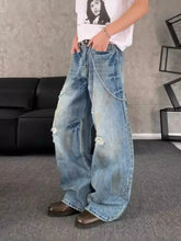 Men’s full size distressed wide leg light-wash denim jeans with chain detail and distressed patches on side seam