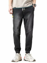 Men’s dark-wash denim joggers with contrasting stitching and a size drawstring loose fit waistband