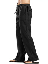 Mens plus size drawstring pants in black with pockets worn with flip-flops
