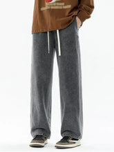 Men’s plus size relaxed fit wide leg dark gray denim pants with white drawstrings and faded wash