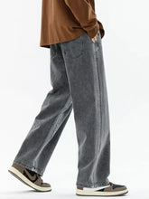 Men’s plus size wide leg jeans in gray denim with a relaxed fit and faded wash featuring classic stitching details