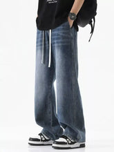Men’s blue denim full size wide leg jeans with white drawstring waist in a relaxed plus size cut